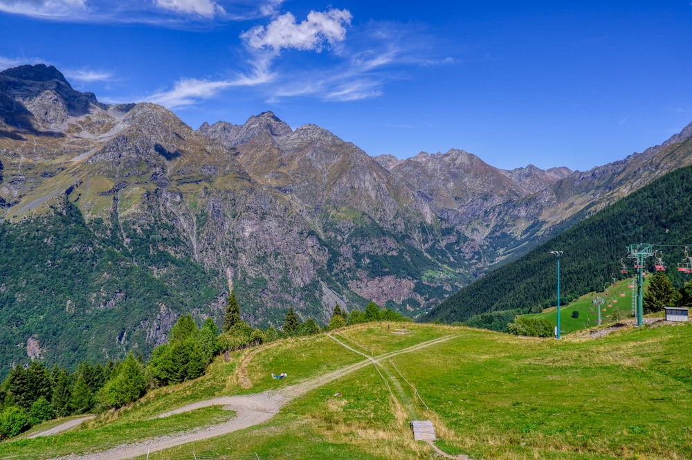 a scenic view of mountains and a trail