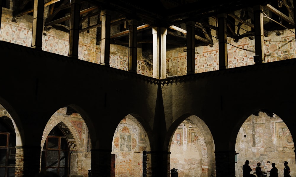 a group of people standing inside of a building