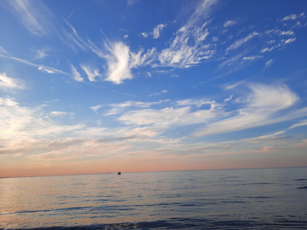 a view of a body of water with a boat in the distance