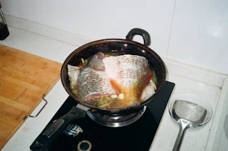A friendly expert sharing seafood cooking tips in a cozy kitchen.