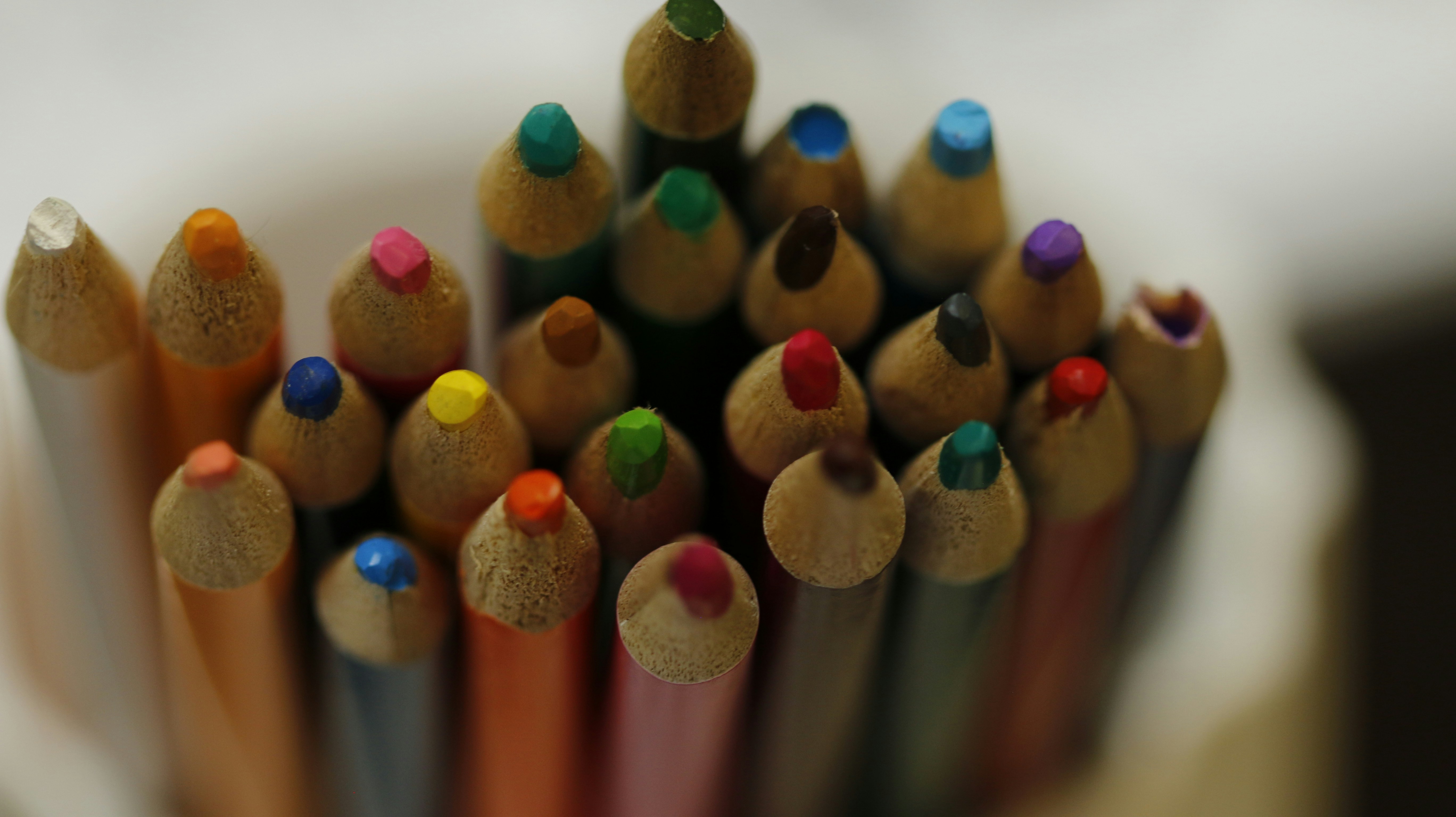 a close up of a group of colored pencils