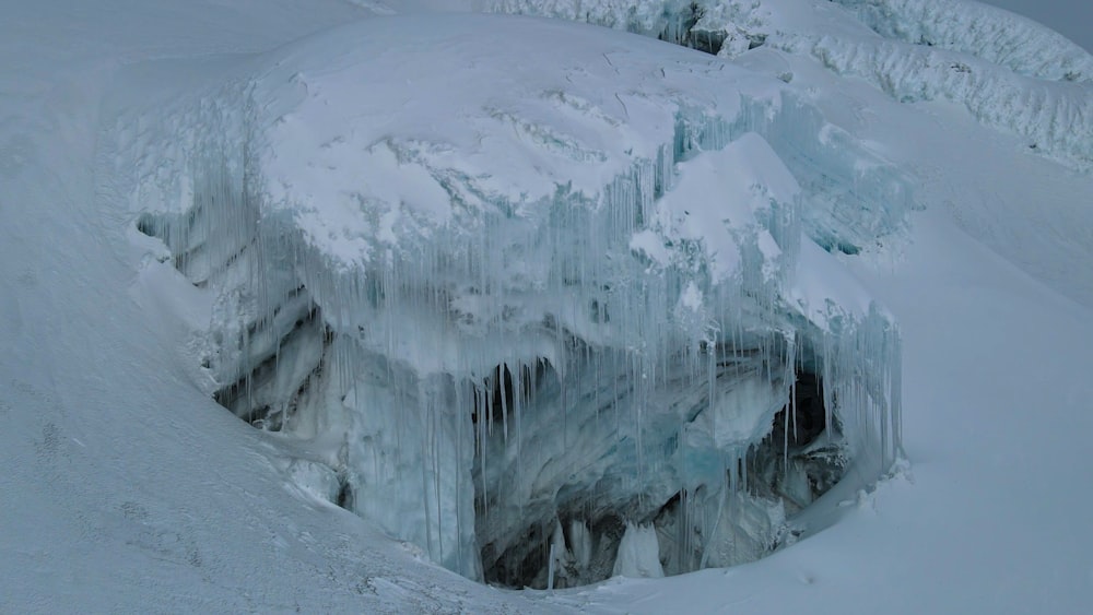 a very large ice formation in the middle of a mountain