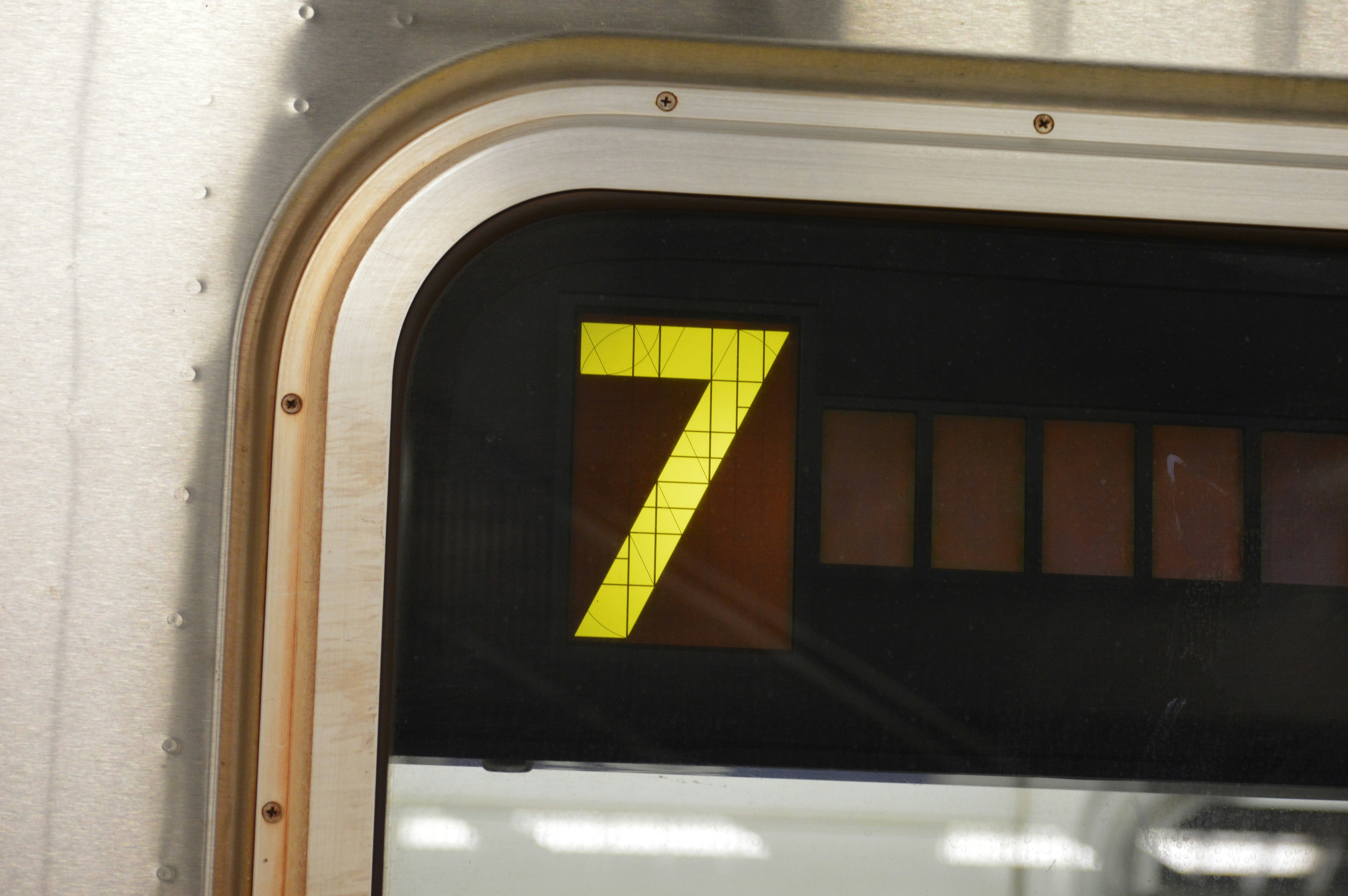 a number seven sign on the side of a train