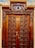 A beautifully restored wooden door with a glossy finish, showcasing expert craftsmanship.