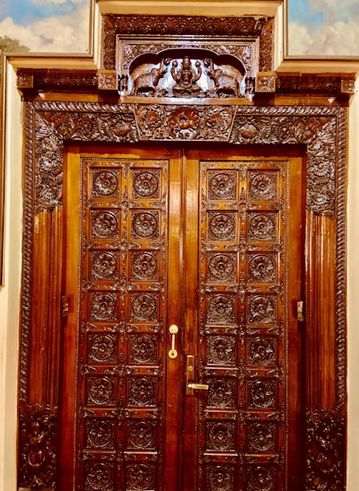 A finely crafted wooden door with intricate carvings, showcasing expert carpentry skills.