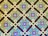 A geometric pattern featuring a repeating diamond motif with intricate tilework. The pattern includes blue circular tiles with white floral designs, contrasted against a background of mint green and brown squares, accented by smaller green and white squares at the intersections.