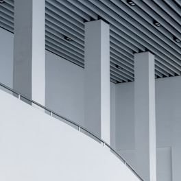 a close up of a building with a curved ceiling