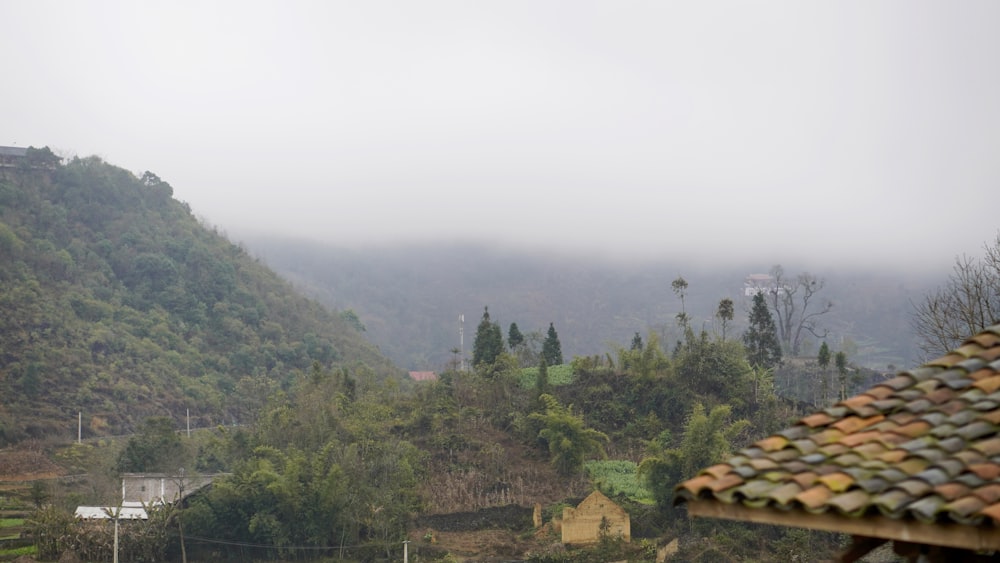 a view of a mountain with a house in the foreground