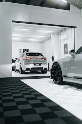 Close-up of a luxury garage floor highlighting the flawless epoxy coating and seamless finish.