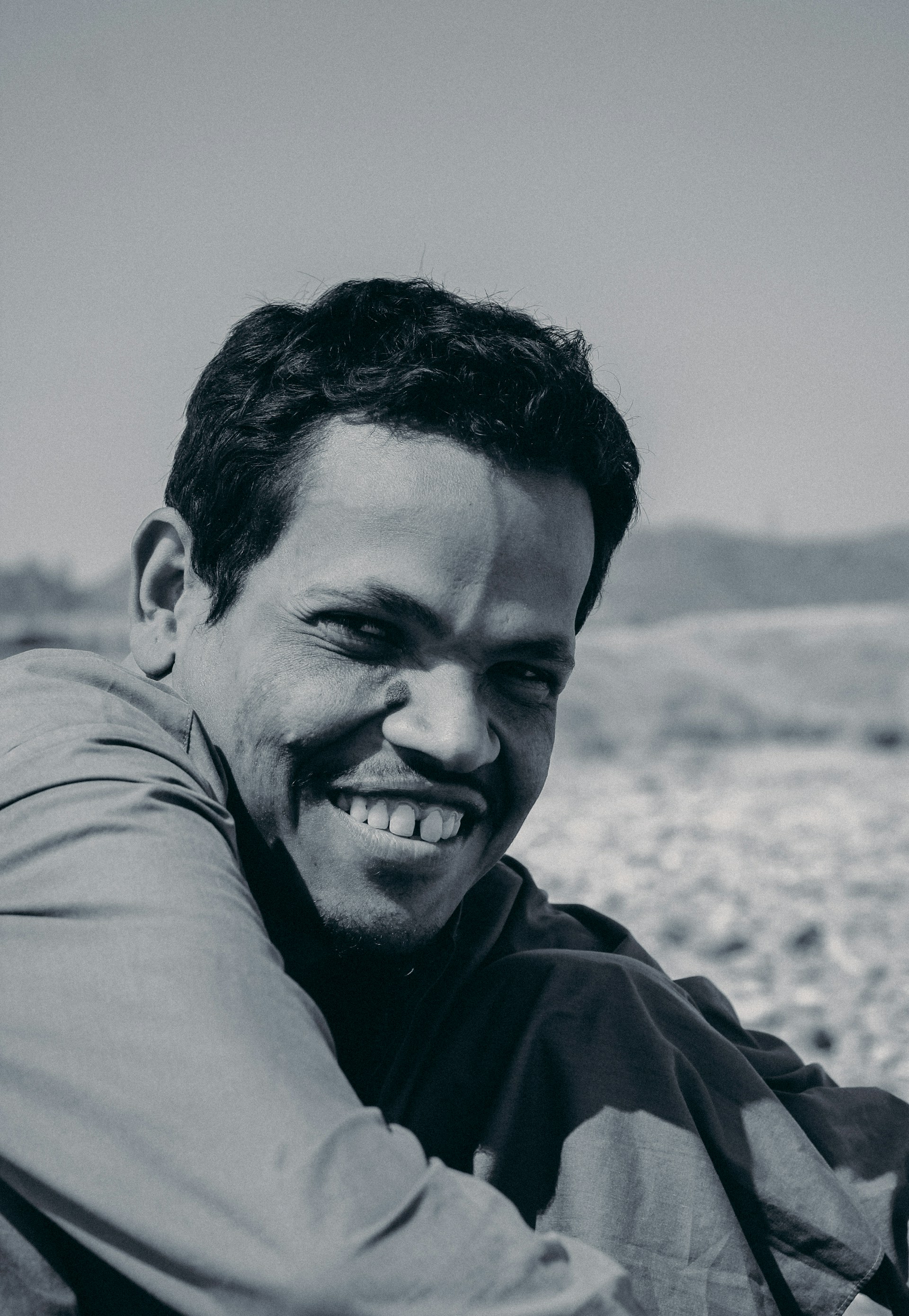 woman wearing yellow long-sleeved dress under white clouds and blue sky during daytime