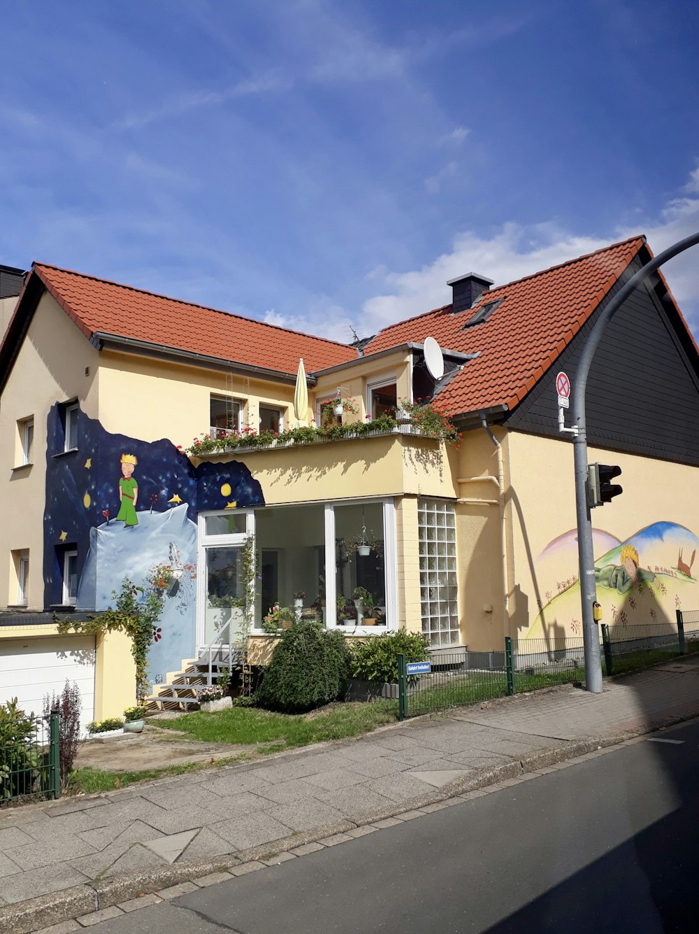 a house with a mural on the side of it