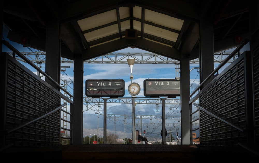 a train station with a clock on the front of it