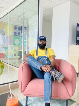 A confident content creator consulting with a lawyer in a sleek, modern office lit by lime green accents.