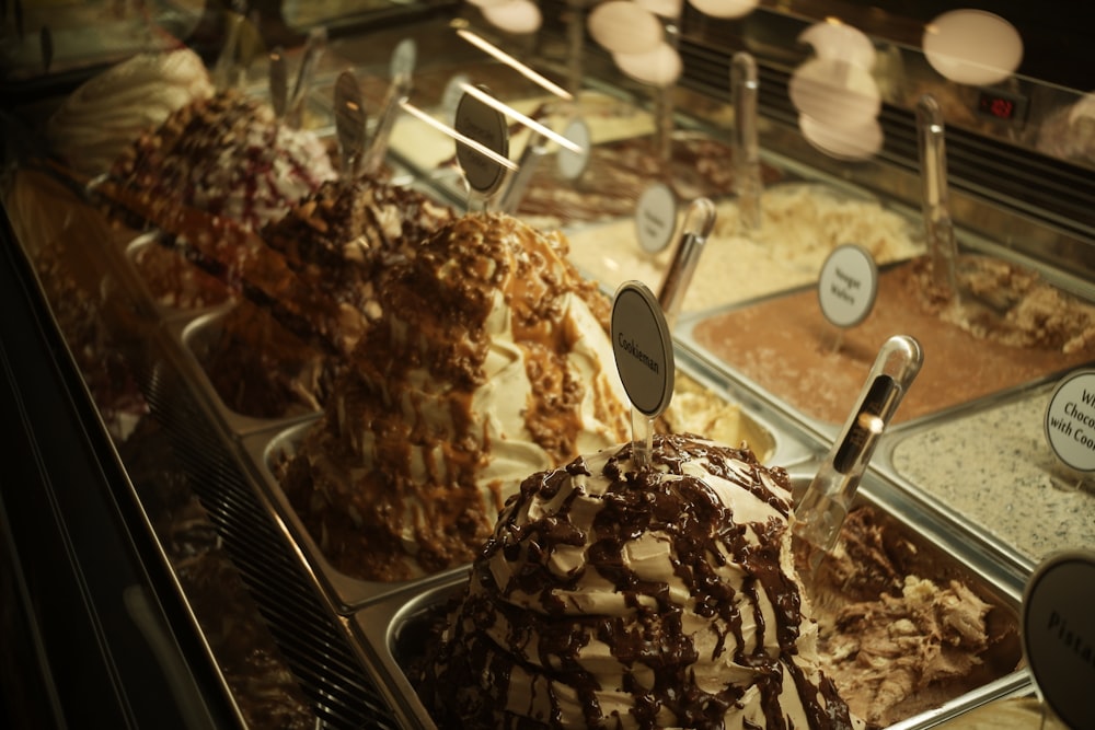 a display case filled with lots of different types of desserts