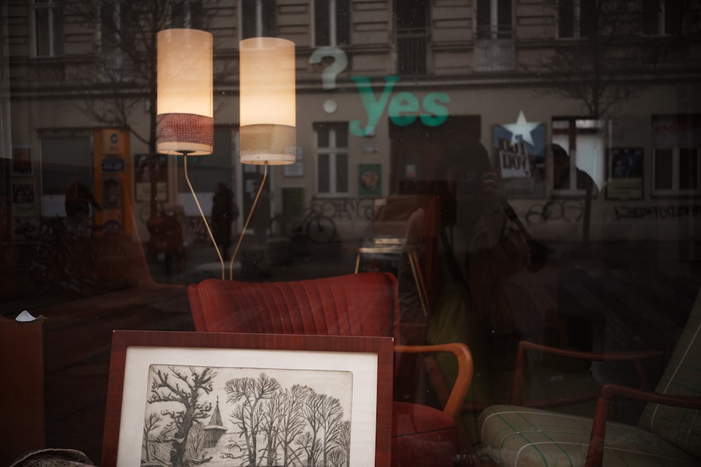 a couple of lamps sitting on top of a table