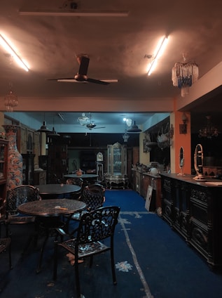 A luxurious display of rare and exquisite collectibles arranged elegantly in a dimly lit room.