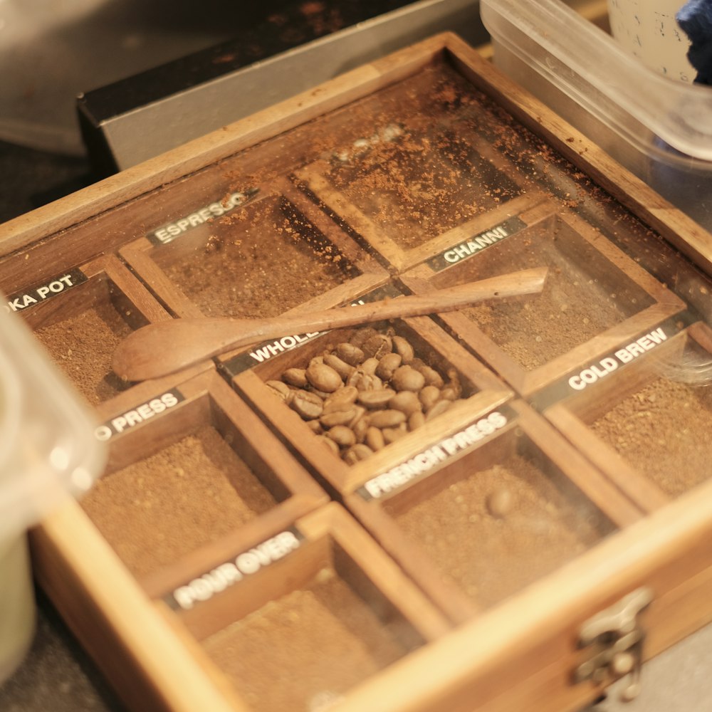 a wooden box filled with lots of nuts