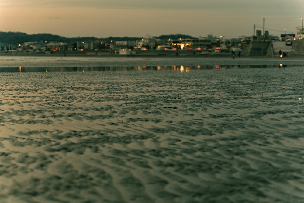 a view of a body of water with a city in the background