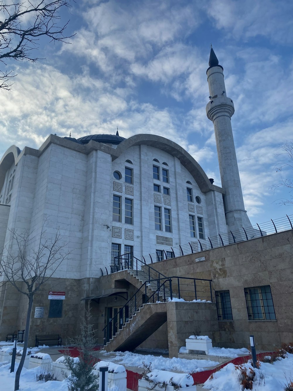 a large white building with a tall tower