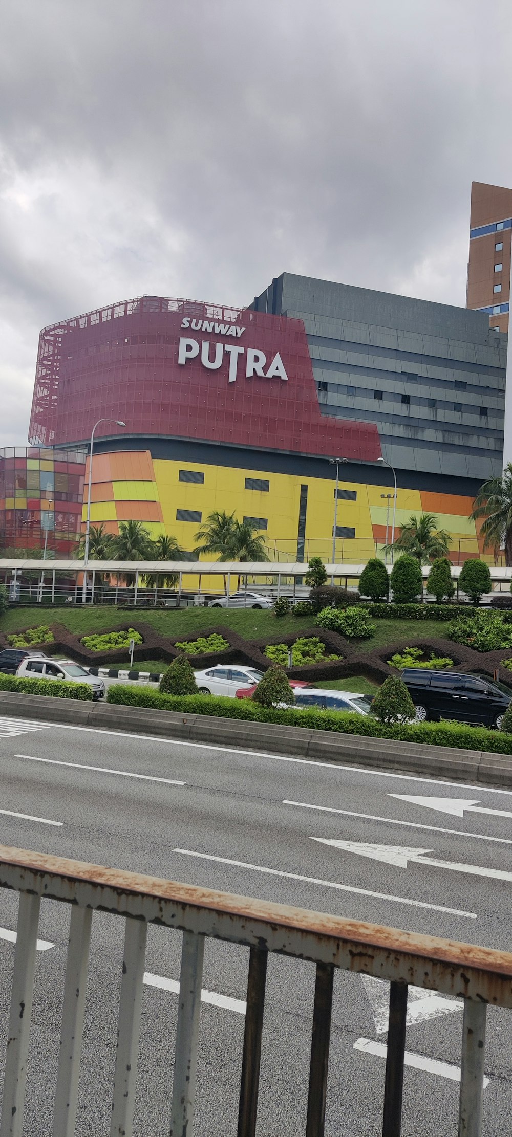 a large building with a red and yellow sign on it's side