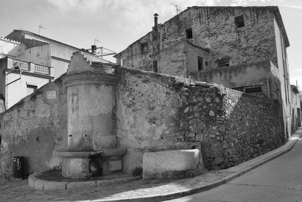 a black and white photo of a stone building