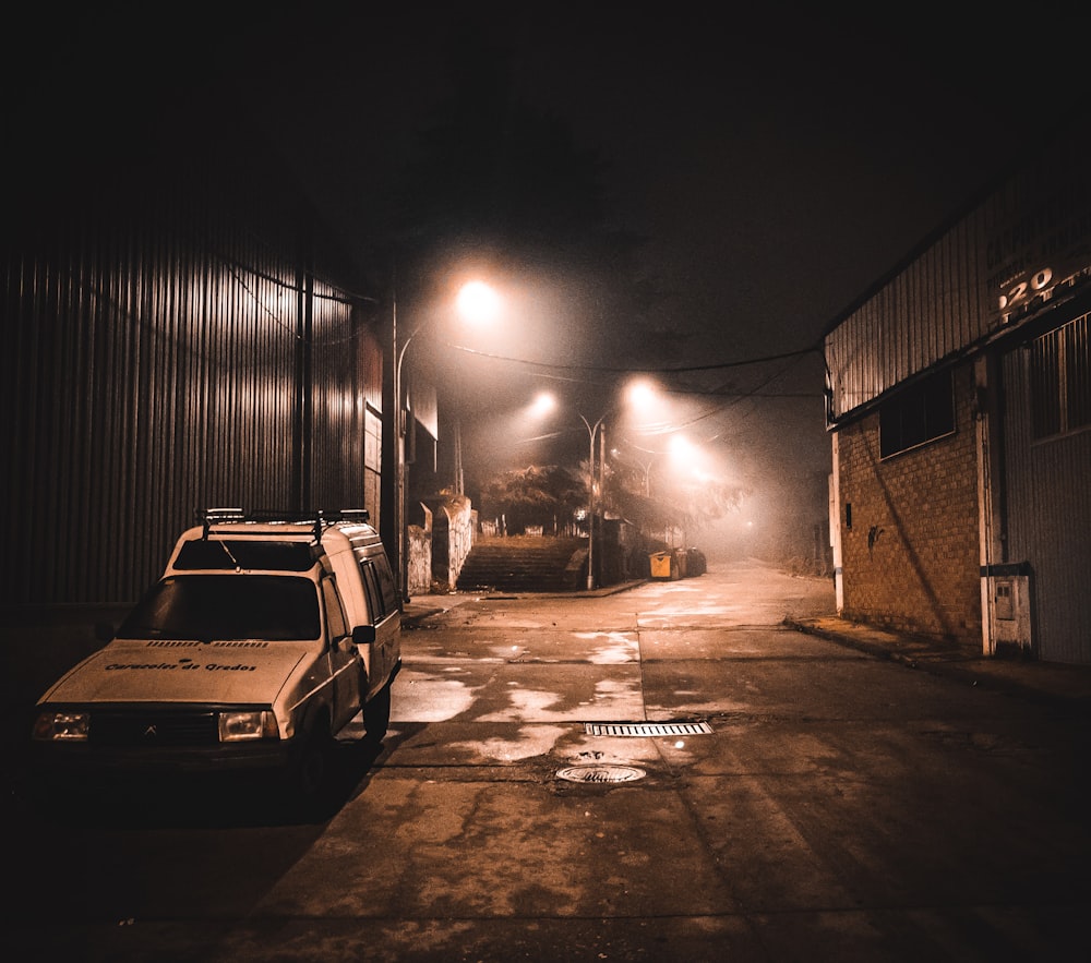 a couple of cars parked next to each other on a street