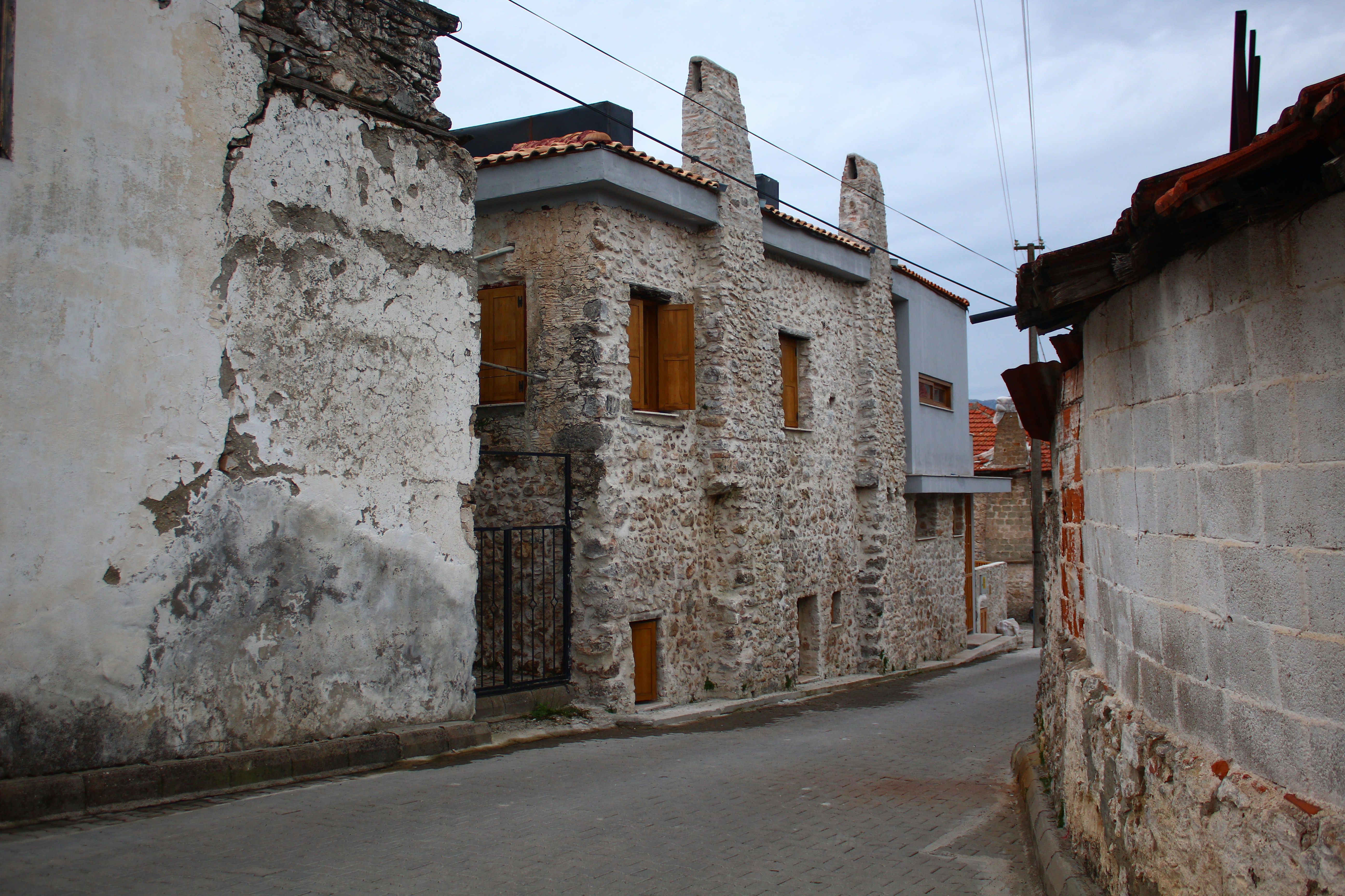 a narrow street with old buildings on both sides