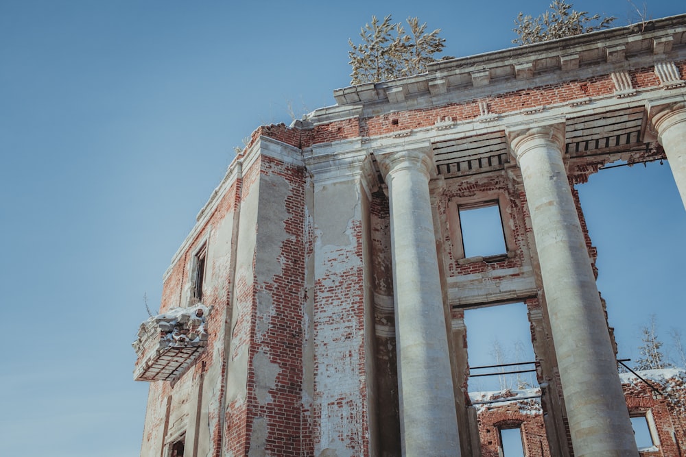 an old building with columns and a clock tower