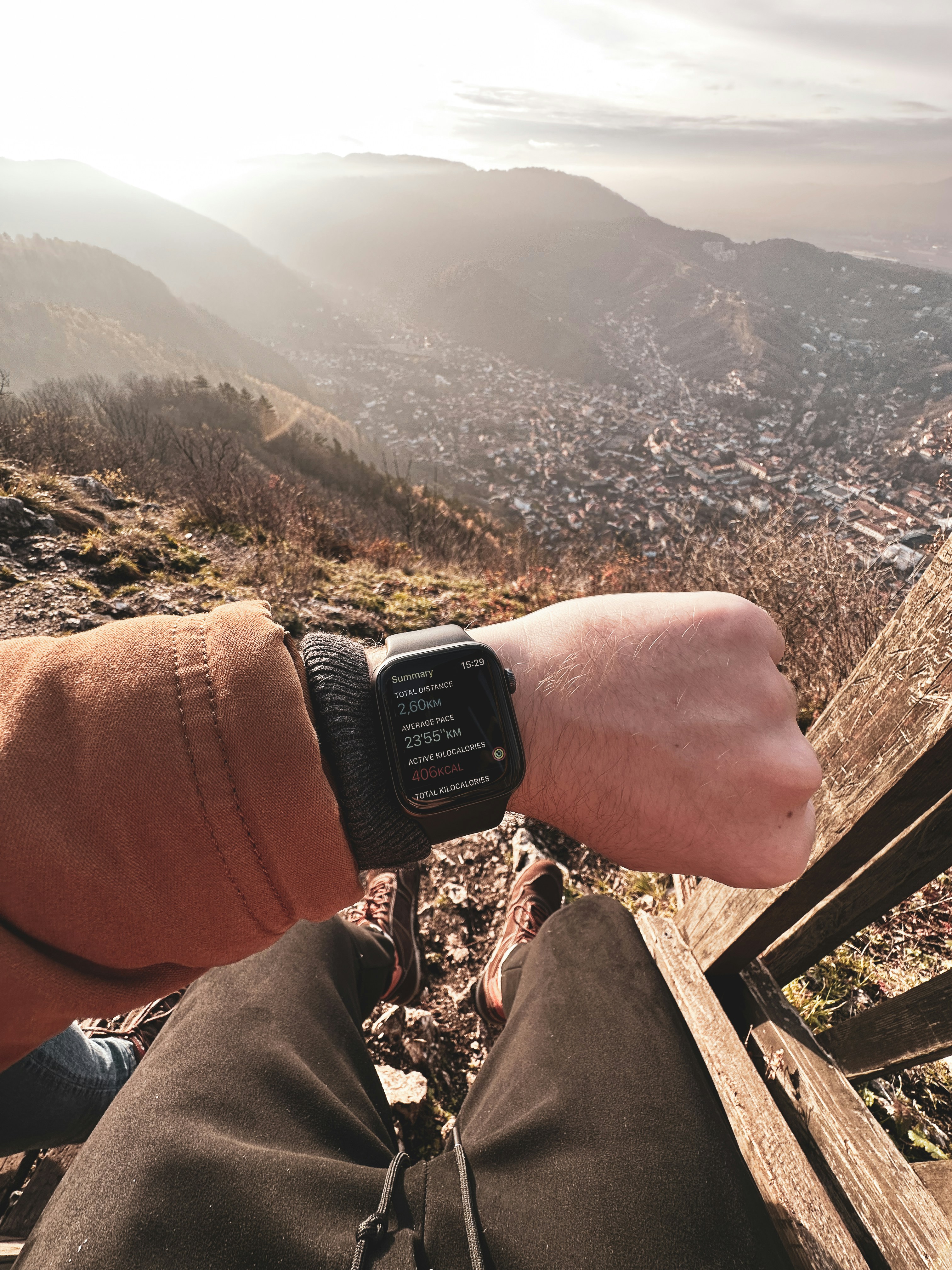 a person is sitting on a bench with a watch on their wrist