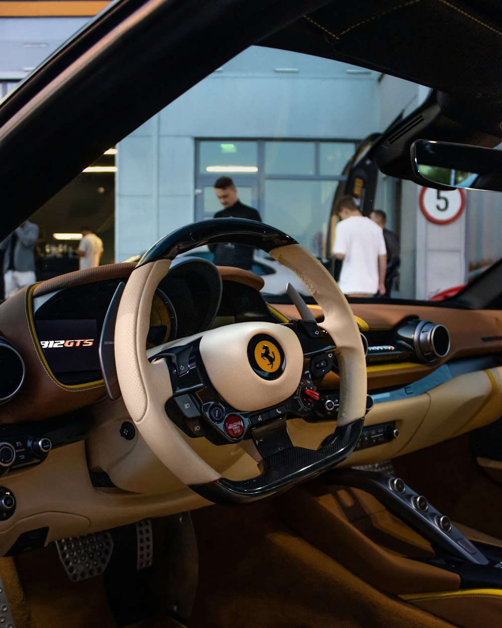 the interior of a sports car with a steering wheel