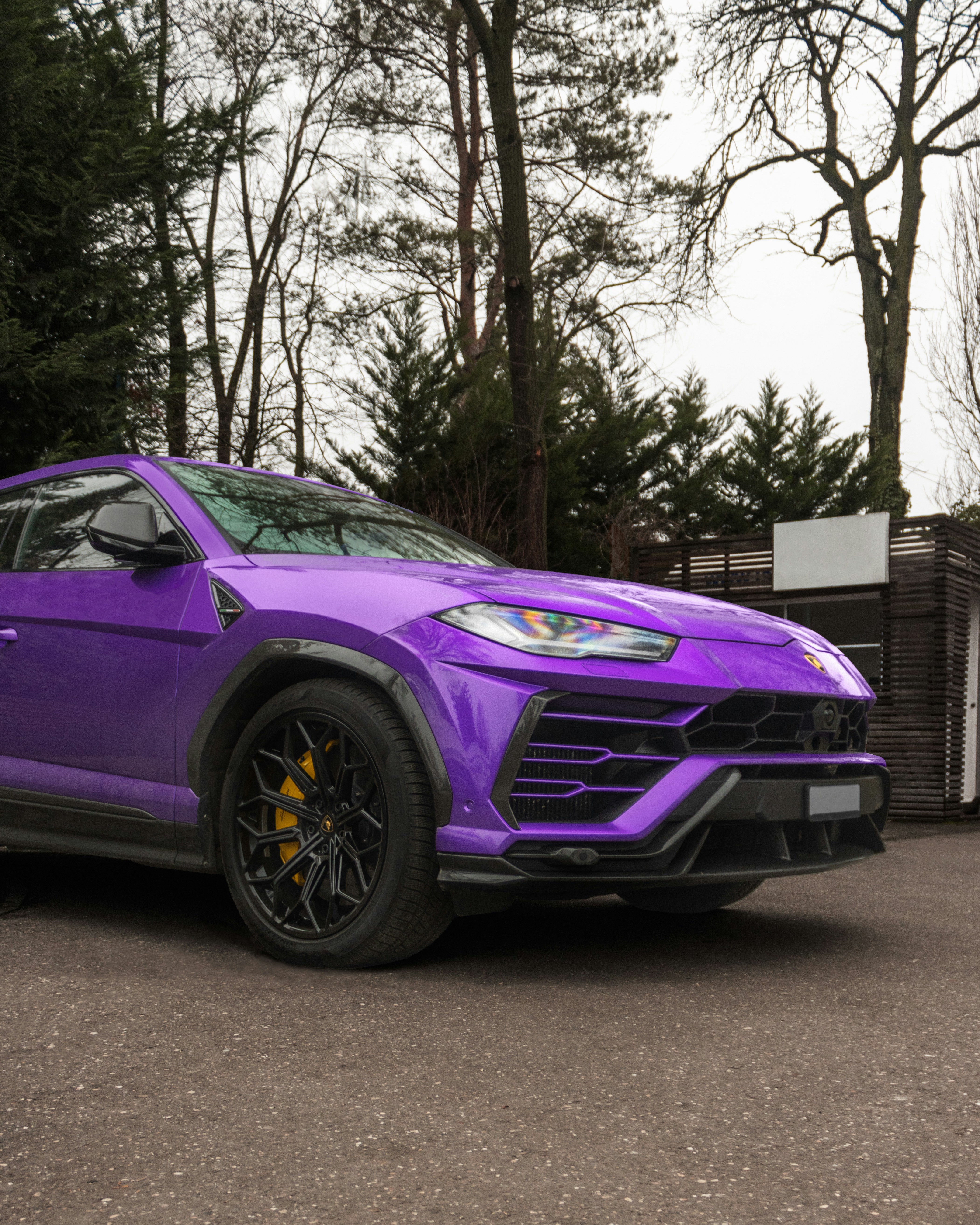 a purple sports car parked in a parking lot