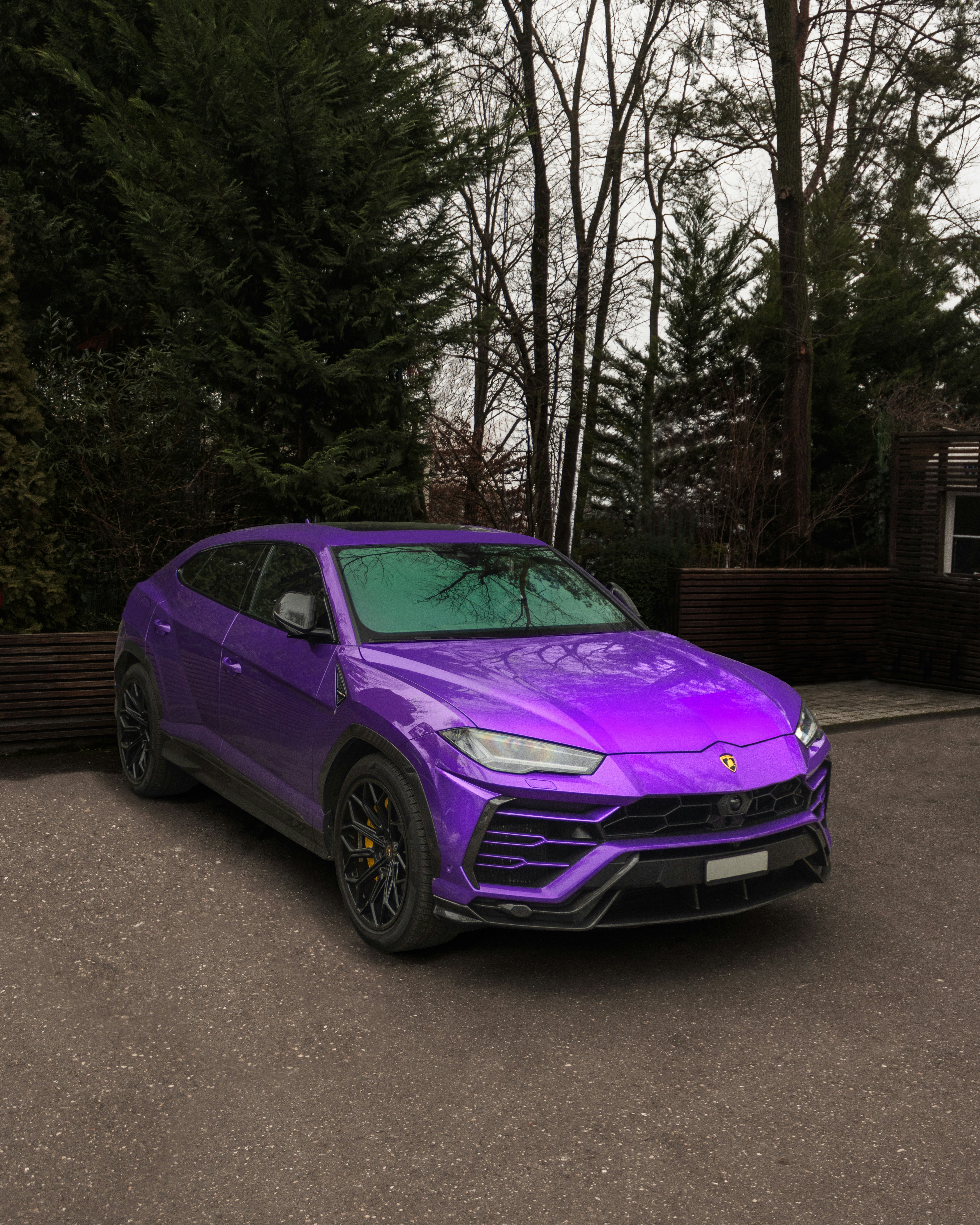 a purple sports car parked in a parking lot
