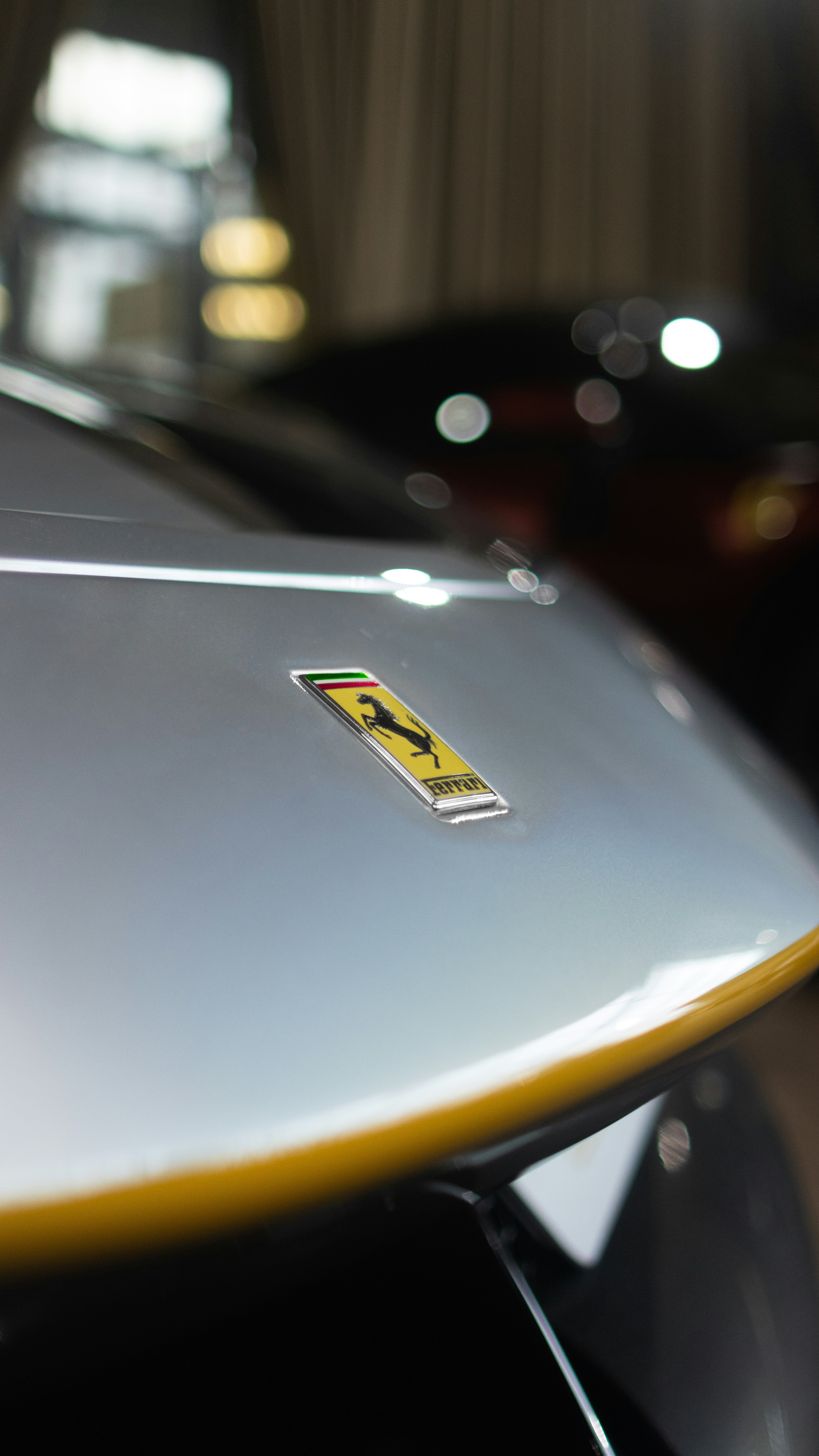 a close up of the hood of a sports car