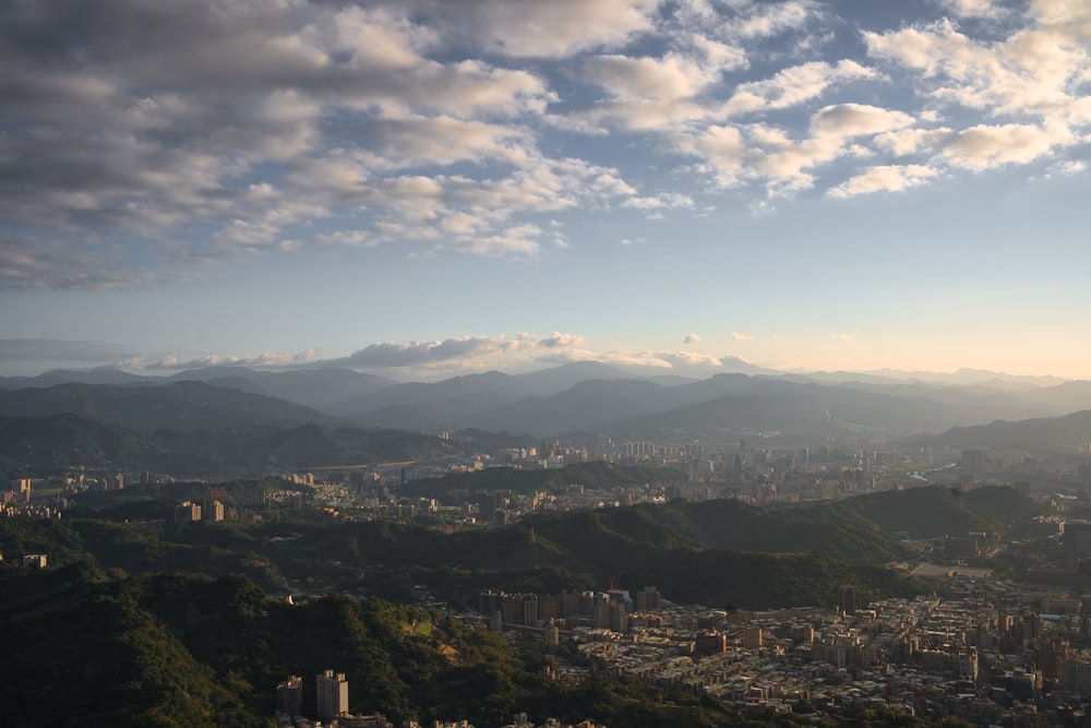 a view of a city with mountains in the background