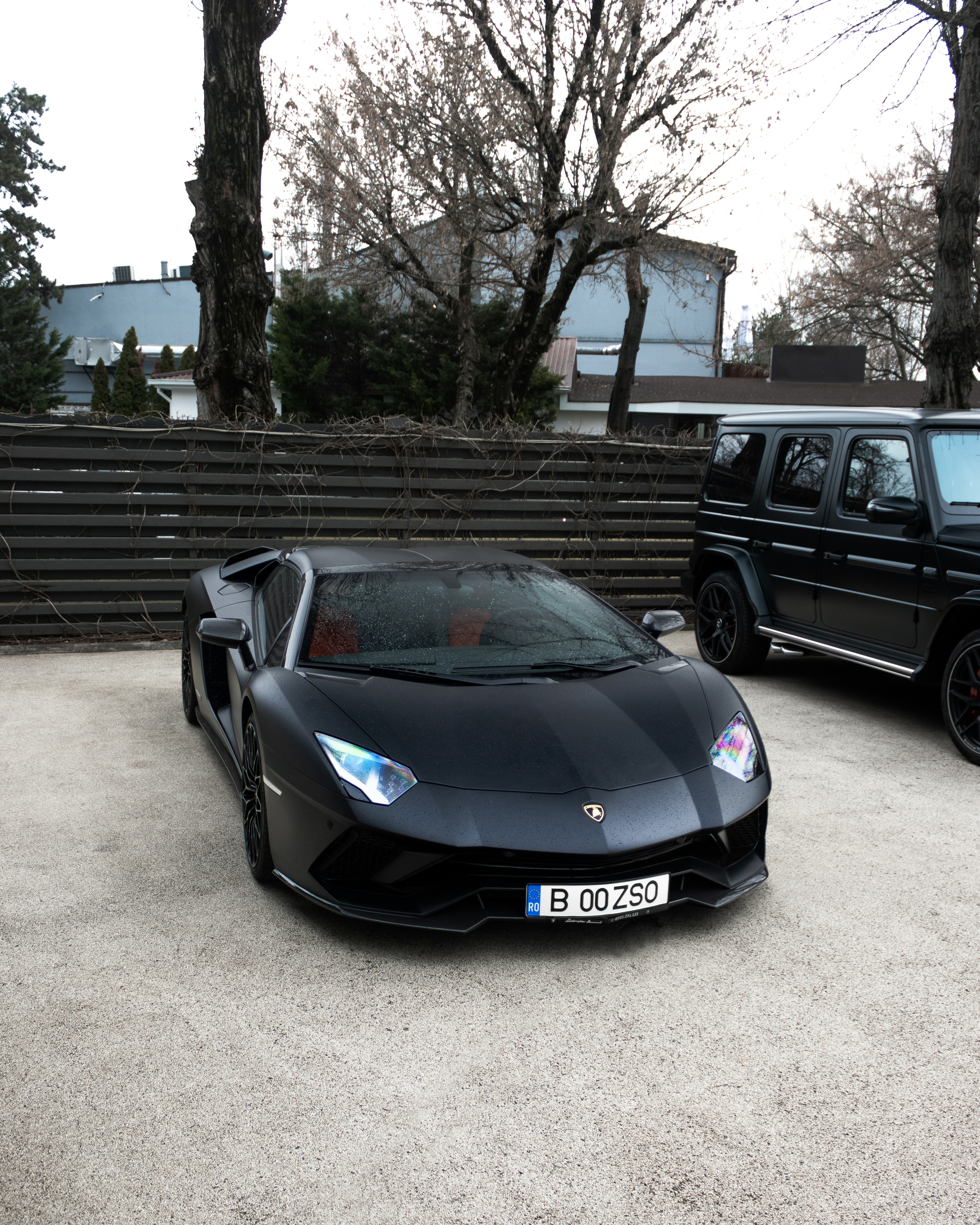 a black sports car parked in a parking lot