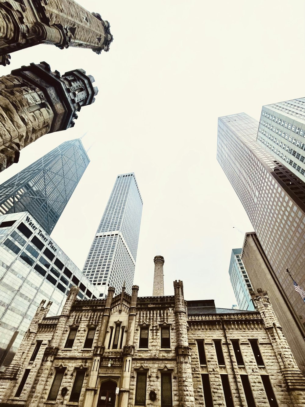 looking up at tall buildings in a city