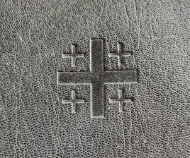 Classic cross emblem embossed on textured old parchment, reflecting heritage and trust.