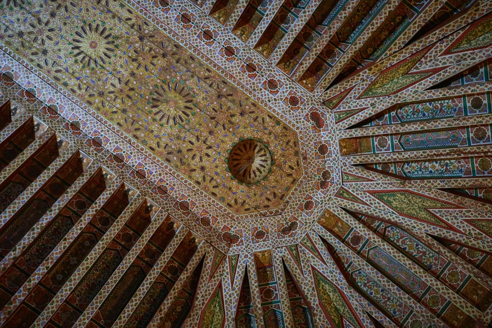 the ceiling of a building with intricate designs