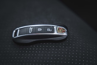 a close up of a remote control on a car