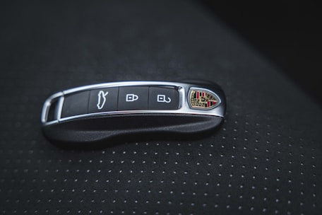 a close up of a remote control on a car