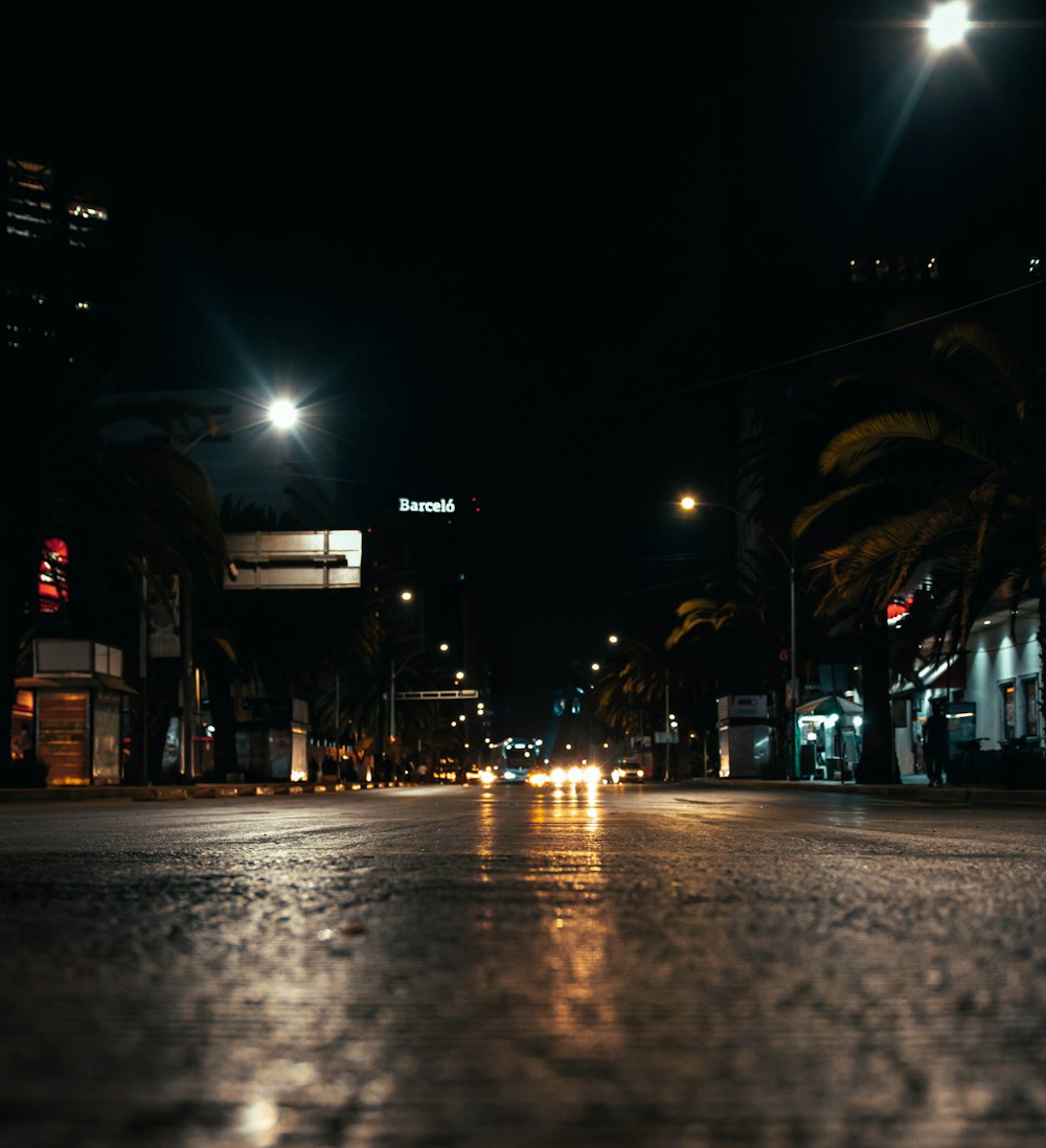 a city street at night with street lights