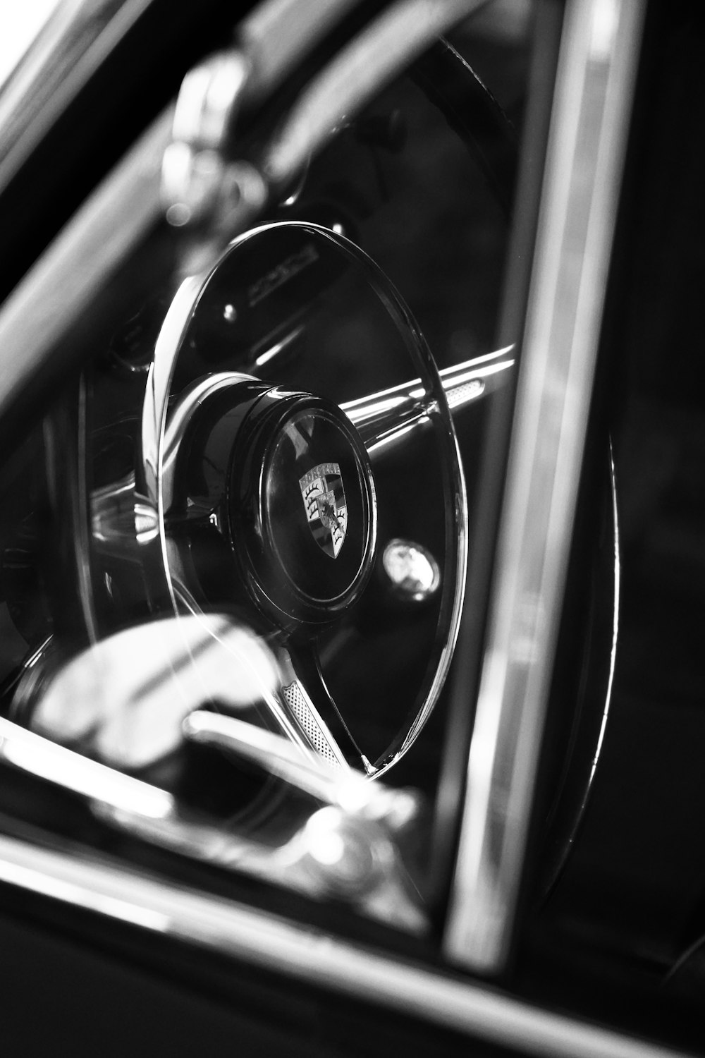 a black and white photo of a steering wheel
