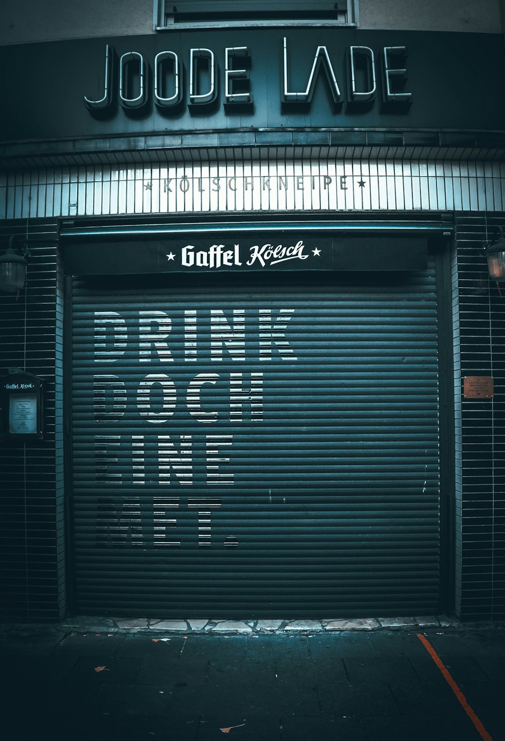 a closed garage door with a sign on it