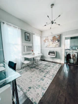 a living room filled with furniture and a rug