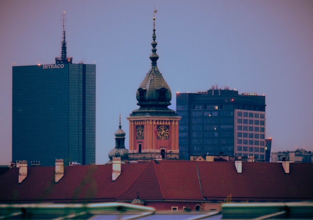 a city skyline with a clock tower in the middle