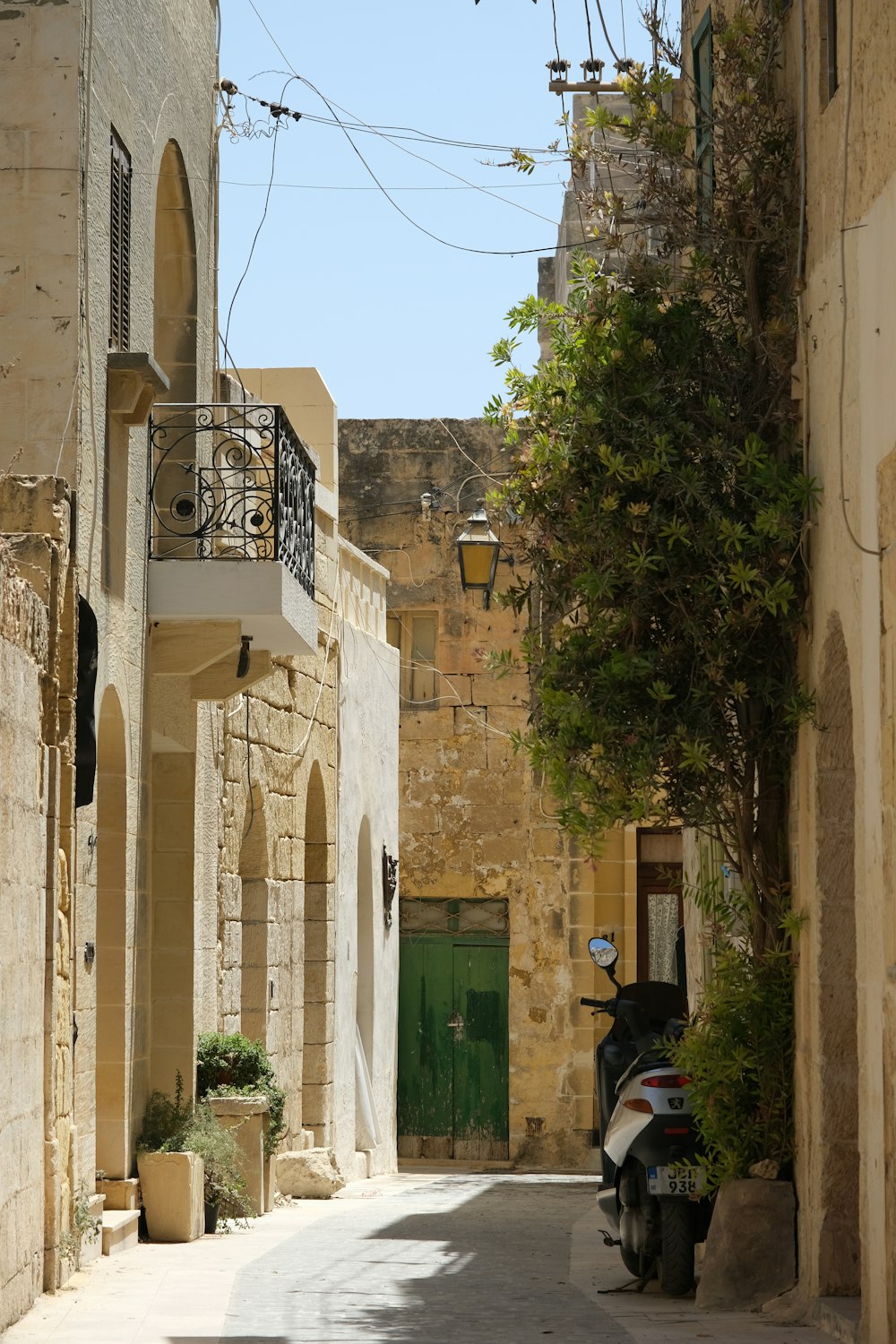 a motor scooter parked on the side of a street