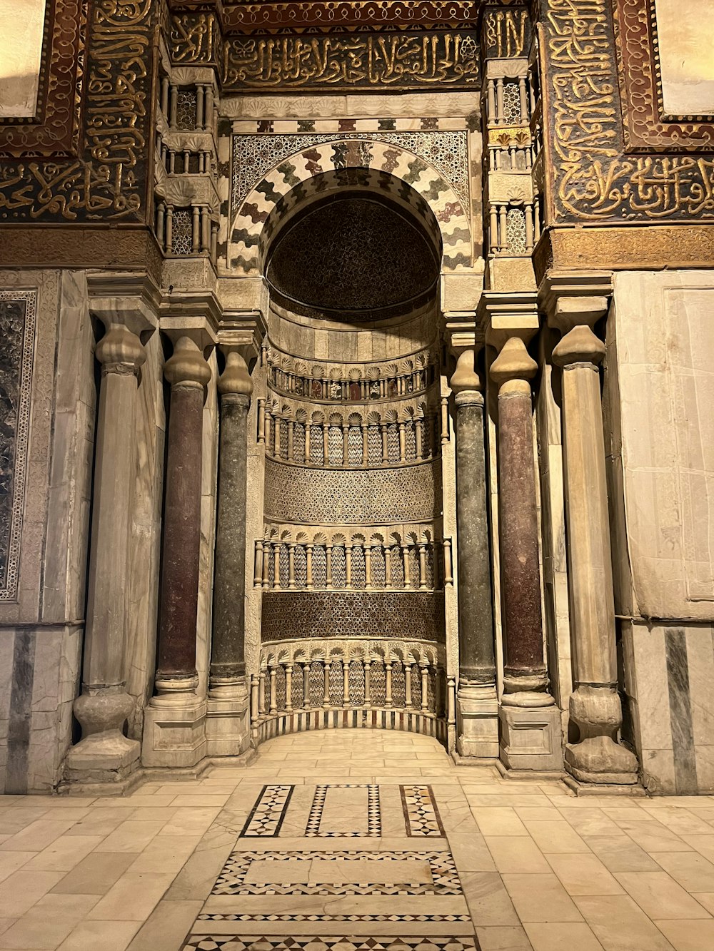 a very ornate building with a clock on the wall