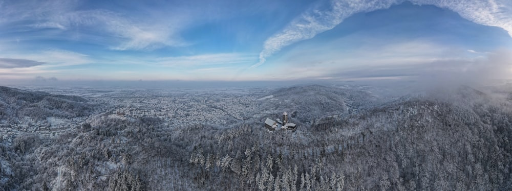 an aerial view of a snowy mountain range