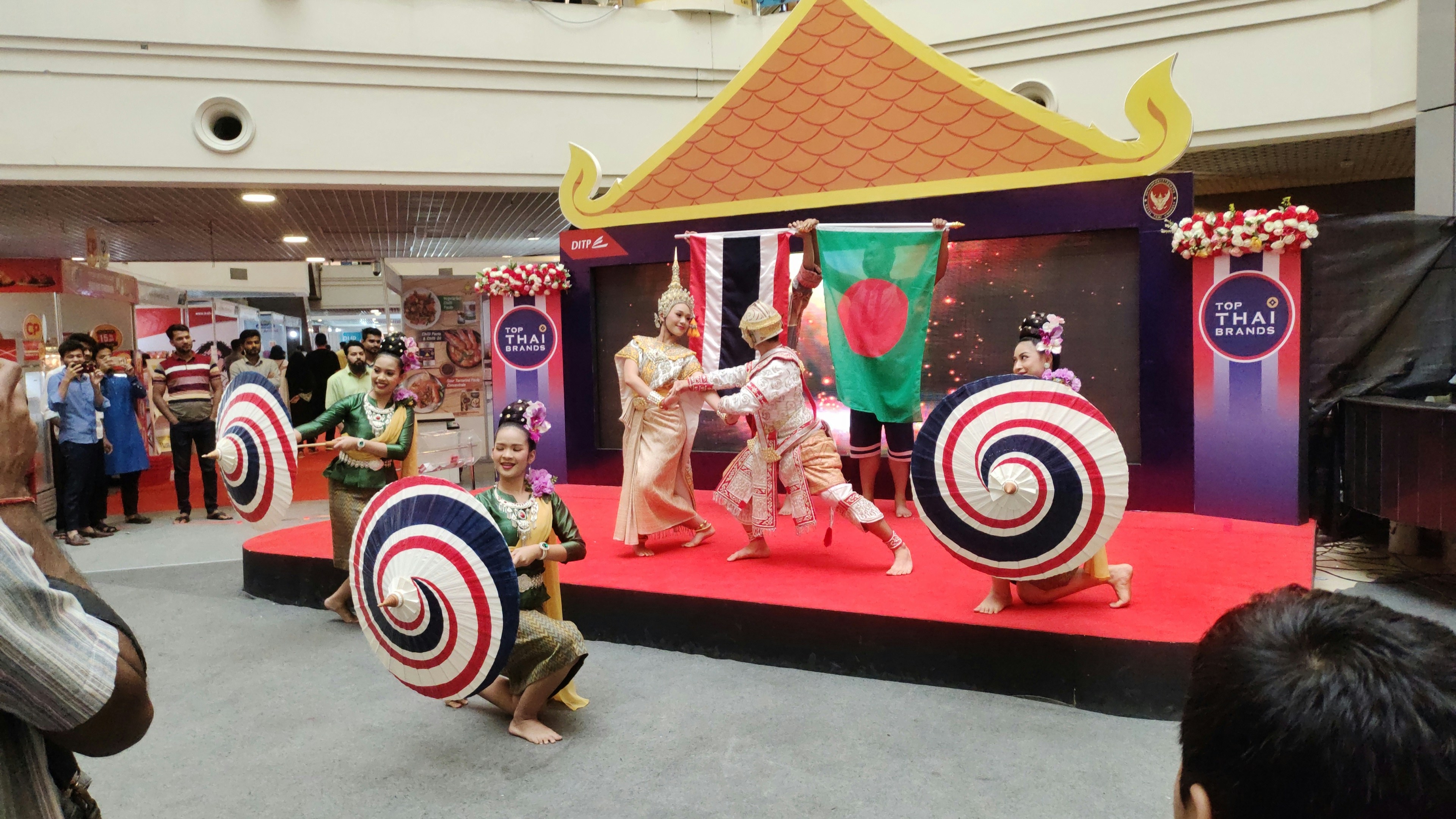 a group of people standing on top of a stage