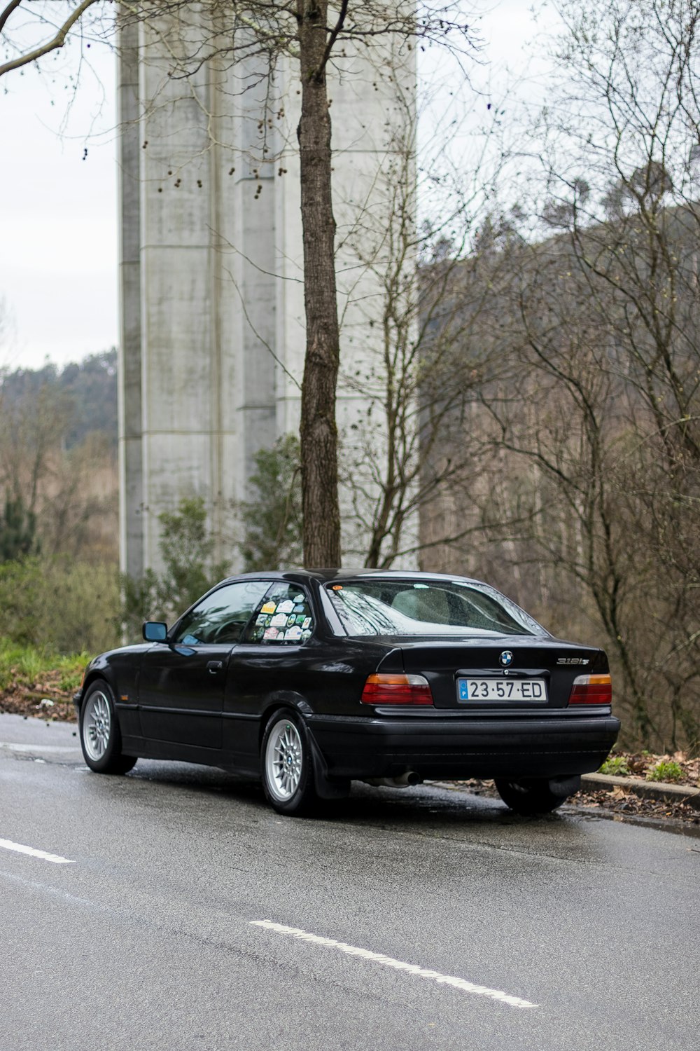 a black car parked on the side of the road